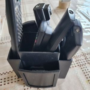 Remote holder in black with slots for photos